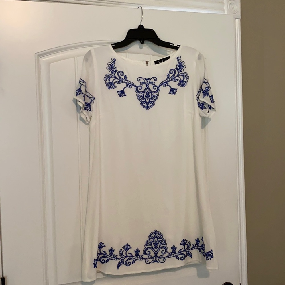 Women’s white embroidered dress.